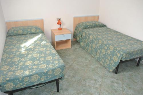 Letto o letti in una camera di Case Vacanza Fenicotteri
