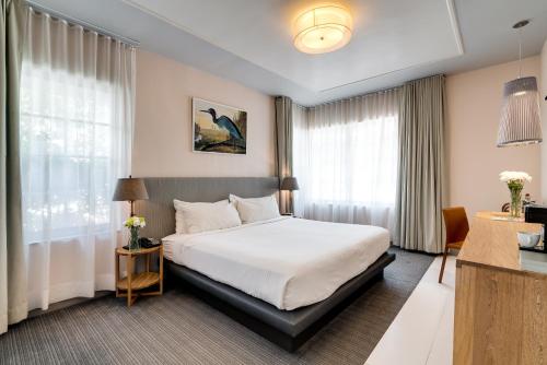 Säng eller sängar i ett rum på South Beach Hotel