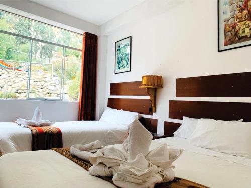 Postel nebo postele na pokoji v ubytování Inka Khawarina Tambo Lodge