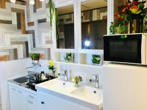 TV a/nebo společenská místnost v ubytování Hotel West Taisho