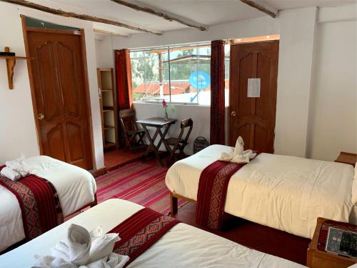 Postel nebo postele na pokoji v ubytování Inka Khawarina Tambo Lodge