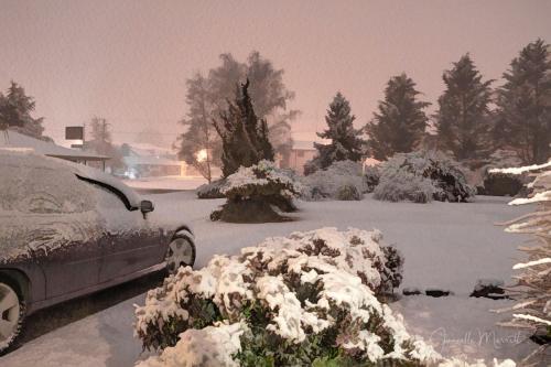 a car parked in a driveway covered in snow at Highlands Motor Inn in Oberon