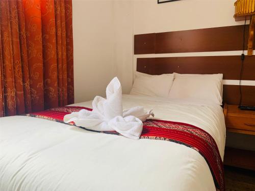 Postel nebo postele na pokoji v ubytování Inka Khawarina Tambo Lodge