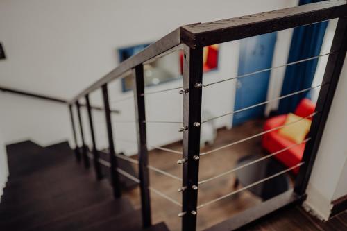 a close up of a metal railing in a room at Trojan House in Ensenada
