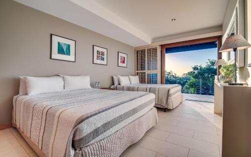 Ένα ή περισσότερα κρεβάτια σε δωμάτιο στο Noosa Residences
