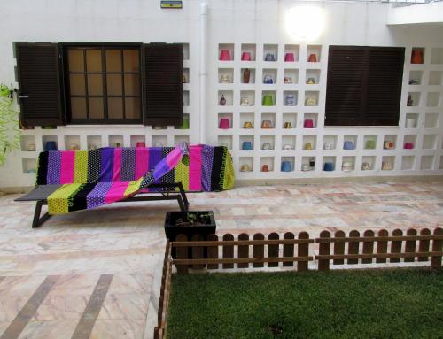 a couch in the courtyard of a house at Go PT - Private challet with swimming pool and garden in Parede