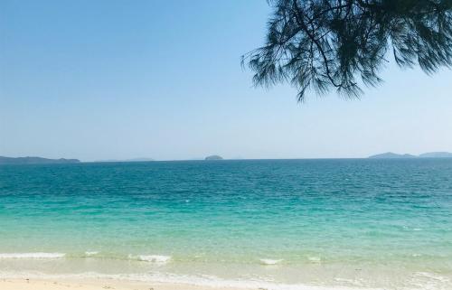 a view of the ocean from a beach at Coto Center Homestay in Dao Co To