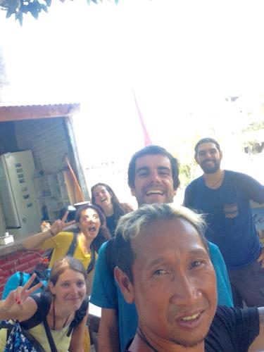 a group of people posing for a picture at Apollo Hostel in Lovina