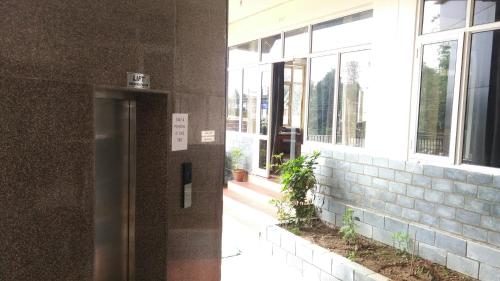 a door in the side of a building at Highland Village Resort in Dharmsala
