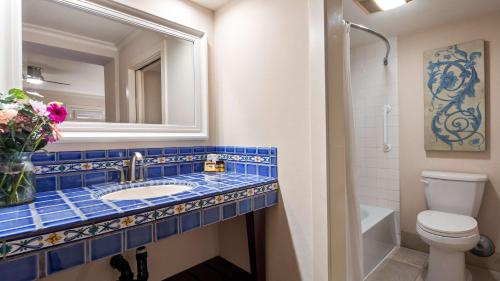 a bathroom with a sink, toilet, and bathtub at Best Western PLUS Island Palms Hotel & Marina in San Diego