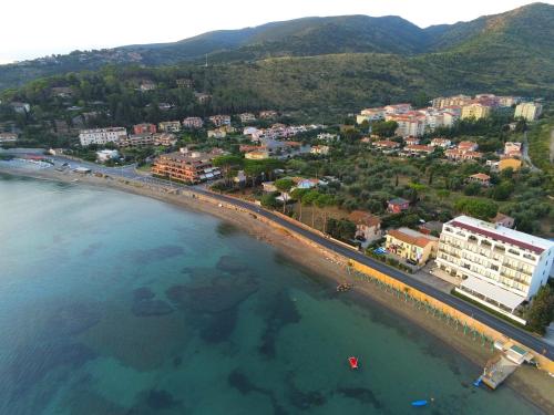 an aerial view of a beach near the ocean at Baia D'Argento in Porto Santo Stefano