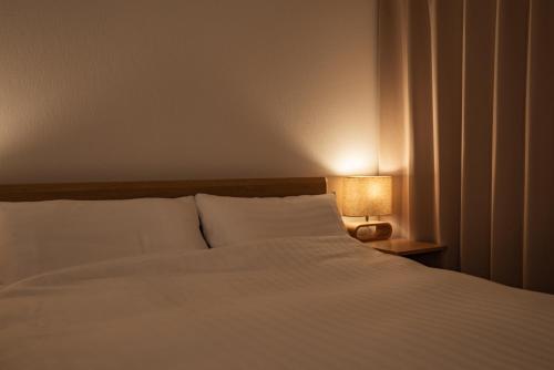 Katil atau katil-katil dalam bilik di H2O Stay Ikebukuro