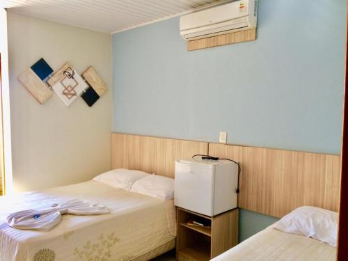 Ліжко або ліжка в номері HOTEL GUAIRACÁ
