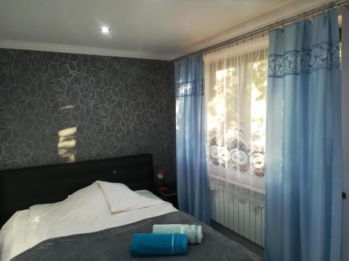 Posteľ alebo postele v izbe v ubytovaní Apartamenty Kletówka