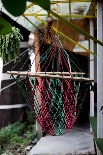 a hammock with nets hanging from it on a porch at Wander Thirst in Kathmandu