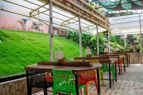 a row of tables and chairs under a greenhouse at Wander Thirst in Kathmandu