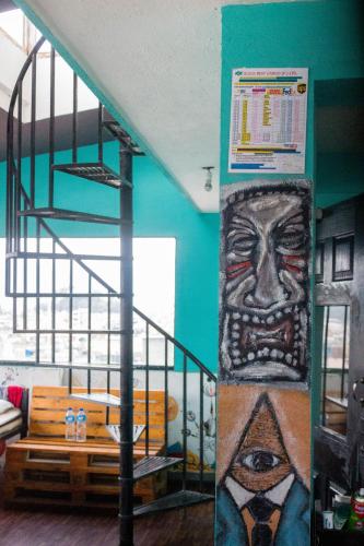 a room with a large painting on the wall at Wander Thirst in Kathmandu