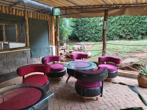 a group of chairs and tables with tires around them at Sahara Gardens-Kericho in Kericho