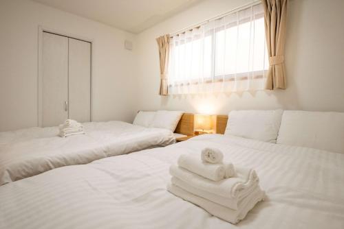 Katil atau katil-katil dalam bilik di H2O Stay Ikebukuro