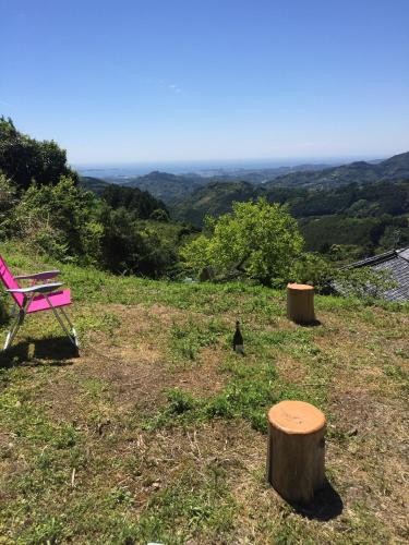 a pink chair sitting on top of a hill at Kumano Winery Guest House in Tanabe