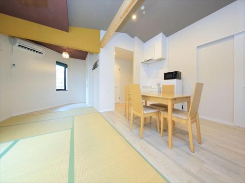 a dining room with a table and chairs at COTO Tokyo Asakusa 4 in Tokyo
