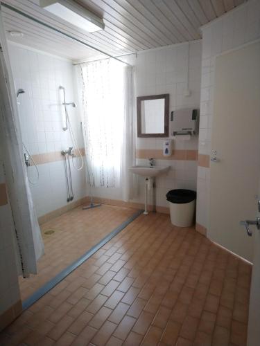 a bathroom with a shower and a sink at LappeanLohi in Lappea