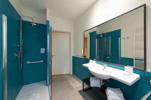 a bathroom with a sink and a mirror at Elizabeth Lifestyle Hotel in Bologna