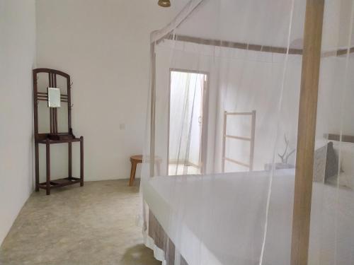 Ένα ή περισσότερα κρεβάτια σε δωμάτιο στο Cinnamon House Hiriketiya