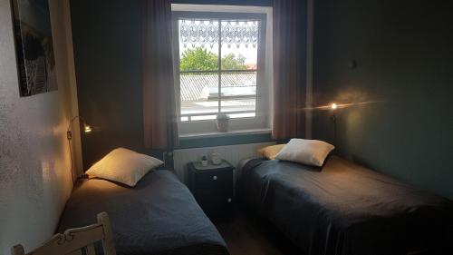 Cama o camas de una habitación en Ferienwohnungen Blischke