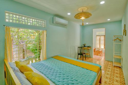 Ένα ή περισσότερα κρεβάτια σε δωμάτιο στο Le Robinet Homestay