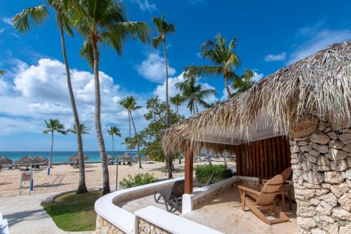 a resort with palm trees on the beach at Viva Dominicus Beach by Wyndham, A Trademark All Inclusive in Bayahibe