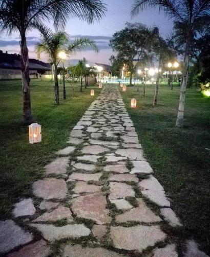 a stone path in a park at night at Agriturismo Fieri in Botricello