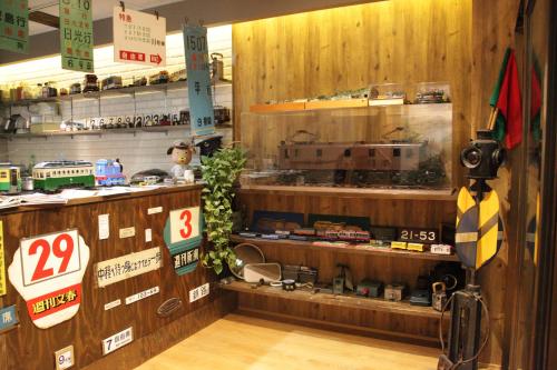 a store with a display of a train on a shelf at 都電屋 TodenHotel in Tokyo