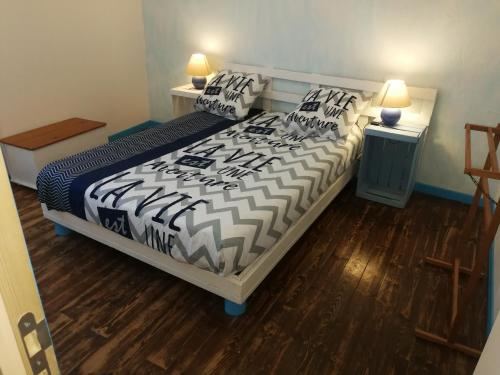 Кровать или кровати в номере Douceur des couverts
