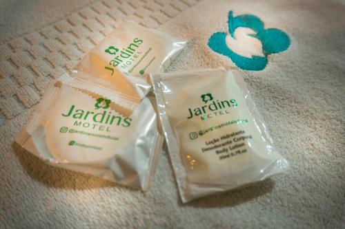 two bags of soap sitting on the floor at Jardins Motel (Adults Only) in Maceió