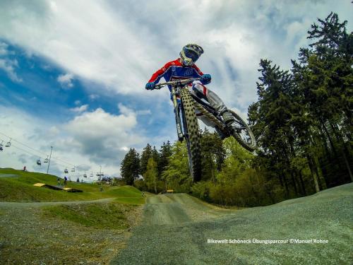 a person jumping a dirt bike in the air at Hotel Tannenhaus in Schöneck