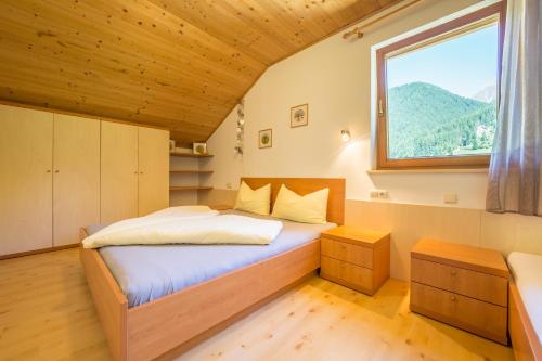 Ένα ή περισσότερα κρεβάτια σε δωμάτιο στο Alpenblick