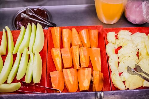 a tray filled with different types of fruits and vegetables at Hotel InterAmericana in Americana