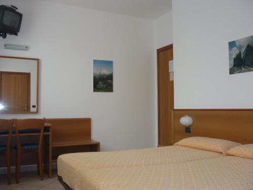 Postel nebo postele na pokoji v ubytování Hotel Milano