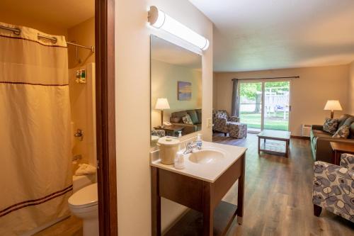 a bathroom with a sink and a toilet at Parkwood Lodge in Fish Creek