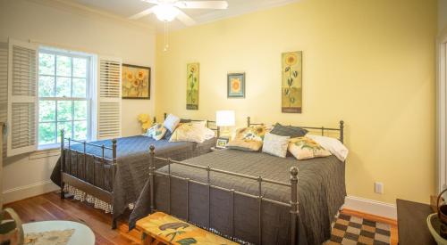 a bedroom with two beds and a window at Hill of Content B&B in Radiant