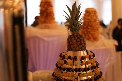 a pineapple is sitting on top of a table at Hotel Skarpa in Sejny