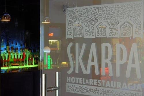 a sign on the window at Hotel Skarpa in Sejny