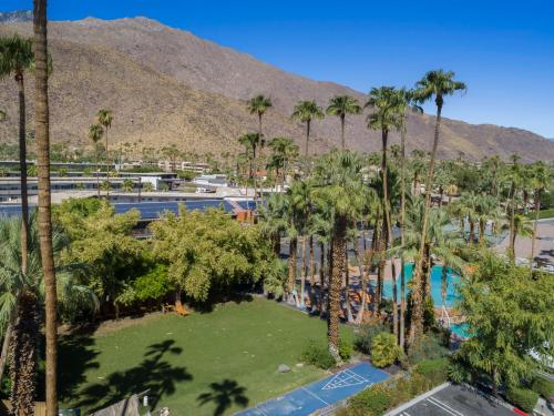 an aerial view of a resort with palm trees at Caliente Tropics in Palm Springs