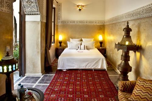 Postel nebo postele na pokoji v ubytování Riad Al Loune