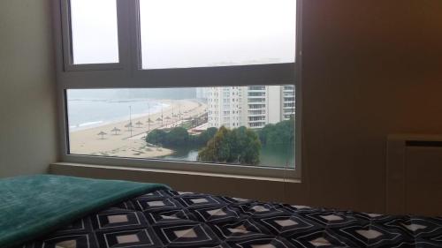 Ένα ή περισσότερα κρεβάτια σε δωμάτιο στο Departamento en primera línea, Papudo Laguna