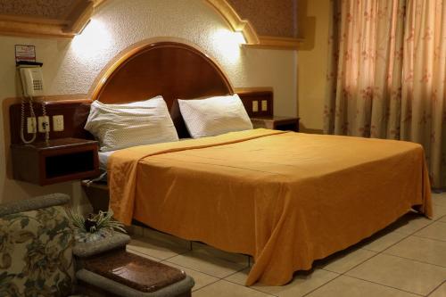 Postel nebo postele na pokoji v ubytování Motel Caribe