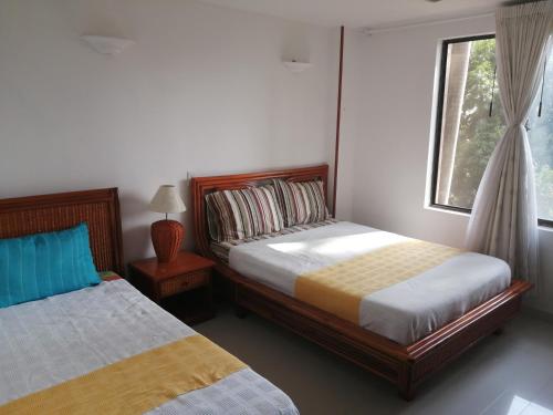 Postel nebo postele na pokoji v ubytování Girardot Resort