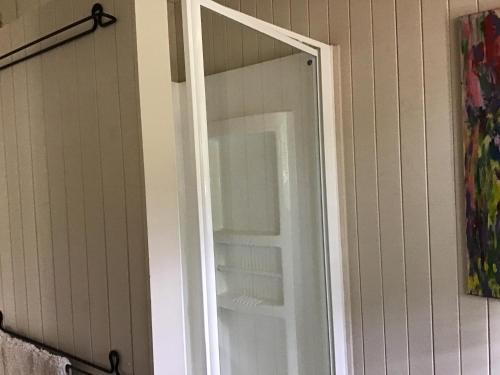 a glass door of a refrigerator in a room at Rossmount Rural Retreat in Goomboorian