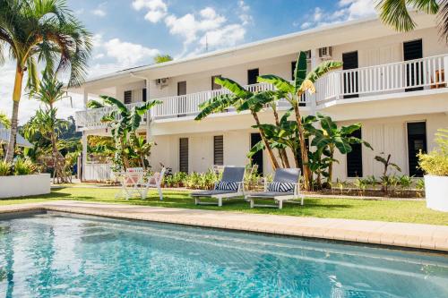 a resort with a swimming pool and a building at Tropicana Lagoon Apartments in Port Vila